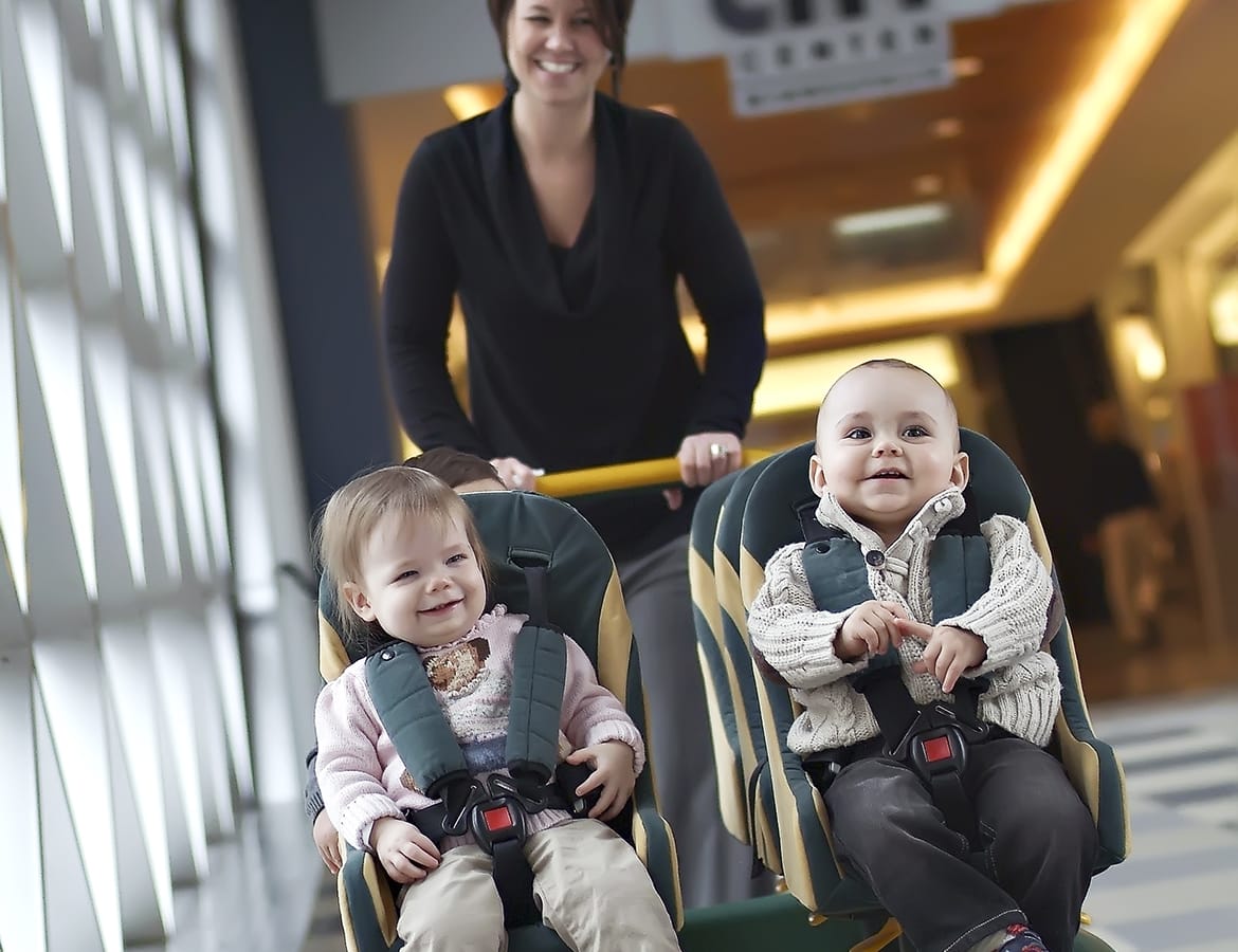 Young children on a walk with daycare provider